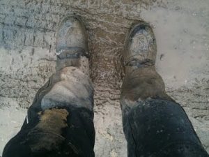 Boots covered in mud