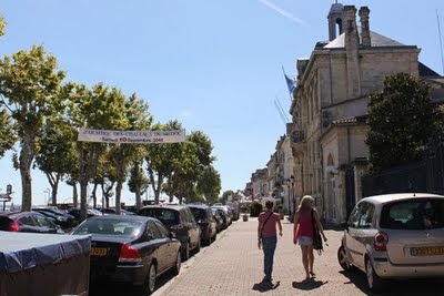 Linzy and Nikole walking down a street in Bourdeaux at the start of the marathon