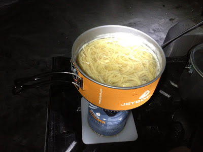 Image of cooking spaghetti while camping