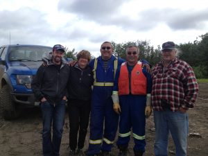 Image of Michael and Judy standing with three men (ferry crew) all smiling