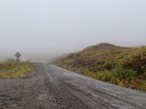 Image of a dirt road in the rain with fog