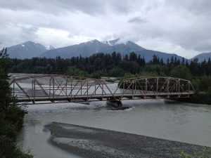 Image of an old single lane bridge over the Chilkat River